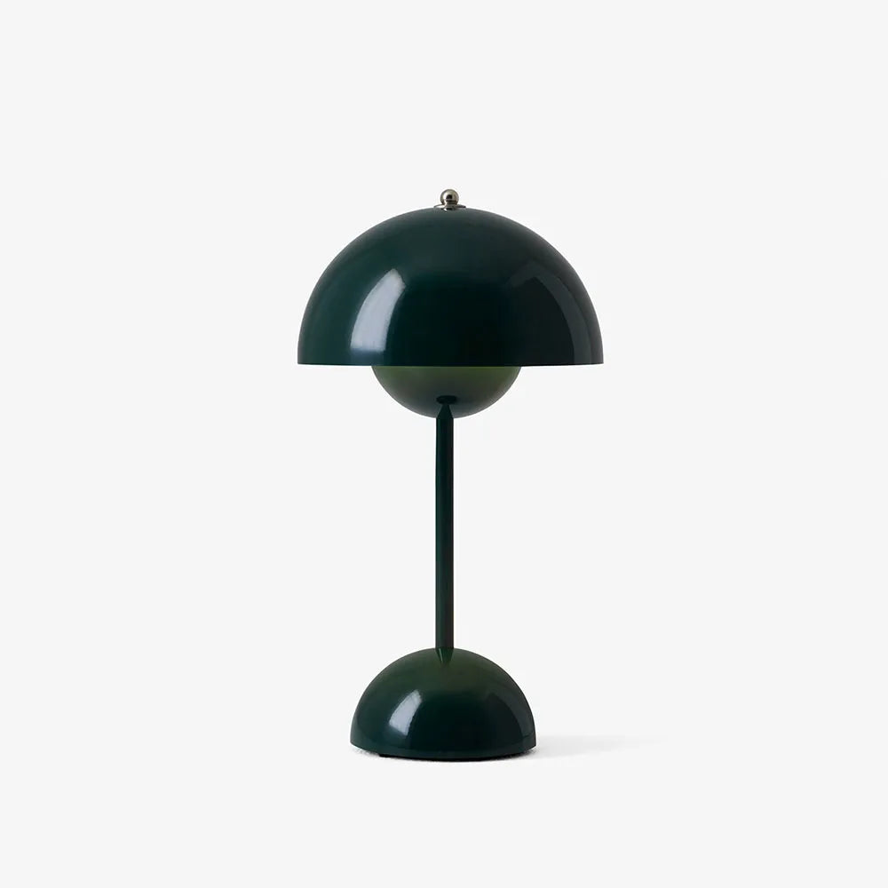 Dark green rechargeable USB table lamp with a round half-sphere base against a plain white background.
