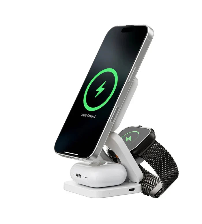 Black foldable magnetic wireless charging station with a phone, smartwatch and earbuds case charging upright.