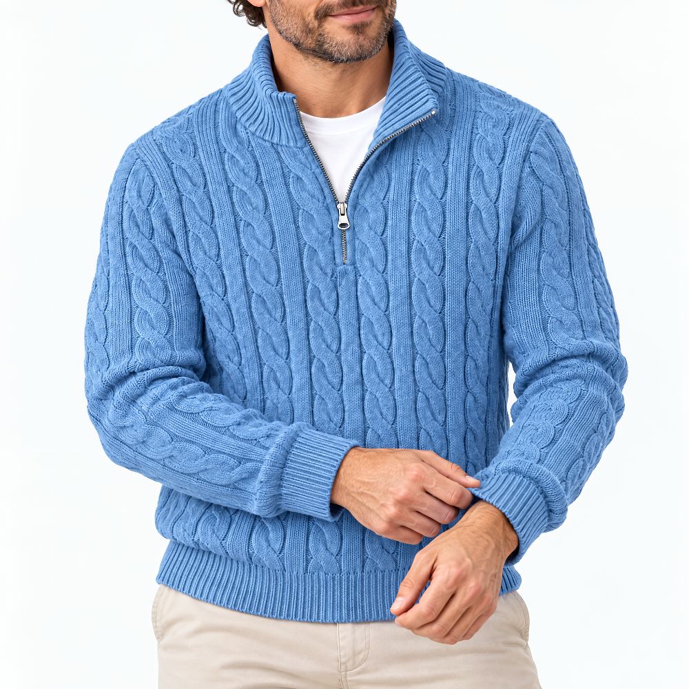 Blue cable knit half-zip sweater on a man over a white tee, front view.