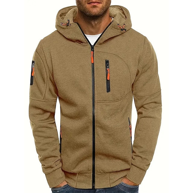 Men's tan zip-up hoodie with orange zipper pulls, black zipper tape, a zippered chest pocket, and a sleeve pocket.