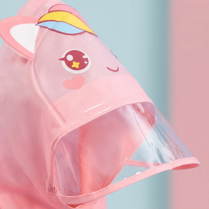 Close-up of a pink unicorn hood showing the cartoon face, small ears, and the clear transparent brim. 6