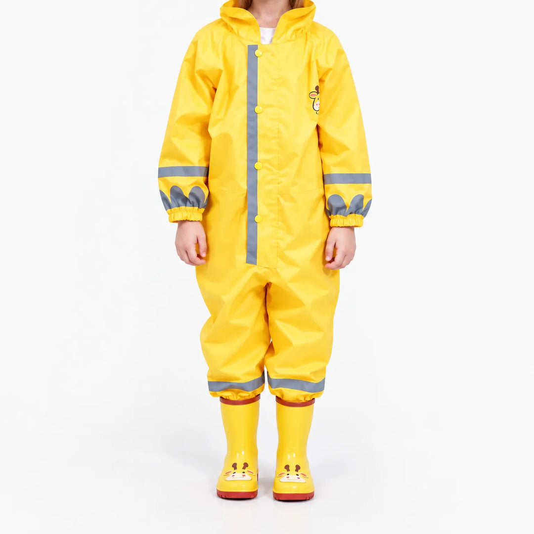 Front view of the yellow jumpsuit on a child, showing snap placket, gray reflective stripes, elastic cuffs and giraffe boots. 2