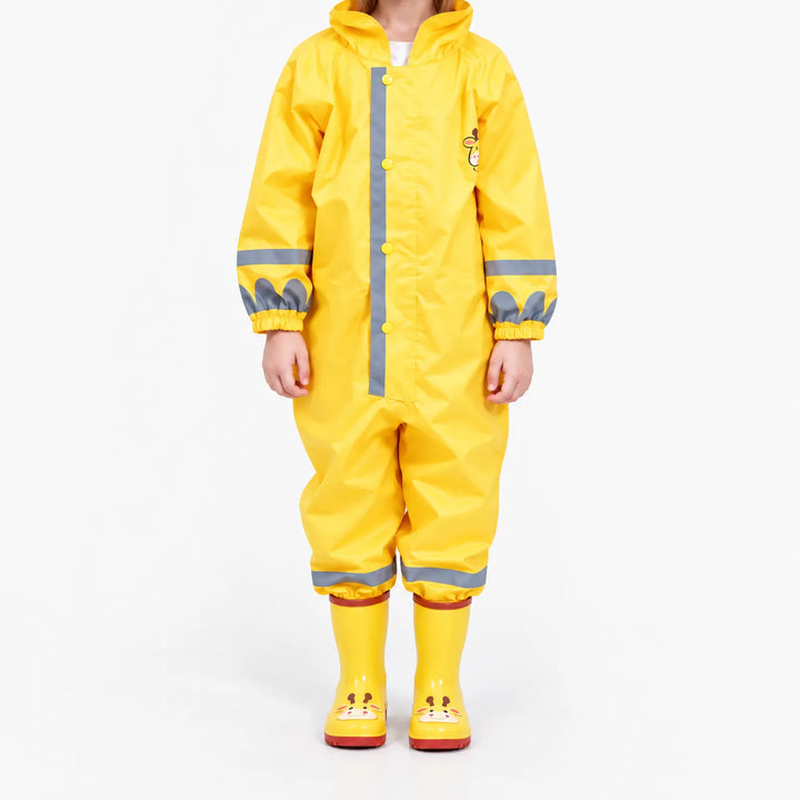 Front view of the yellow jumpsuit on a child, showing snap placket, gray reflective stripes, elastic cuffs and giraffe boots. 2
