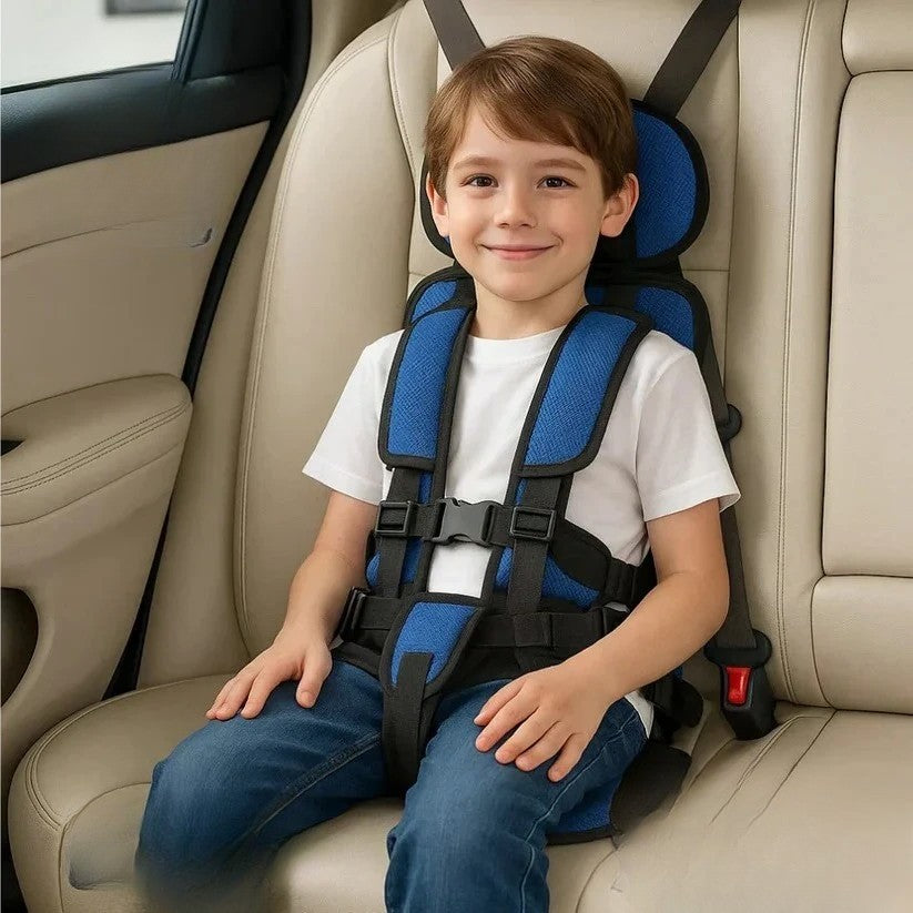 Royal blue foldable kids travel seat harness on a beige back seat.