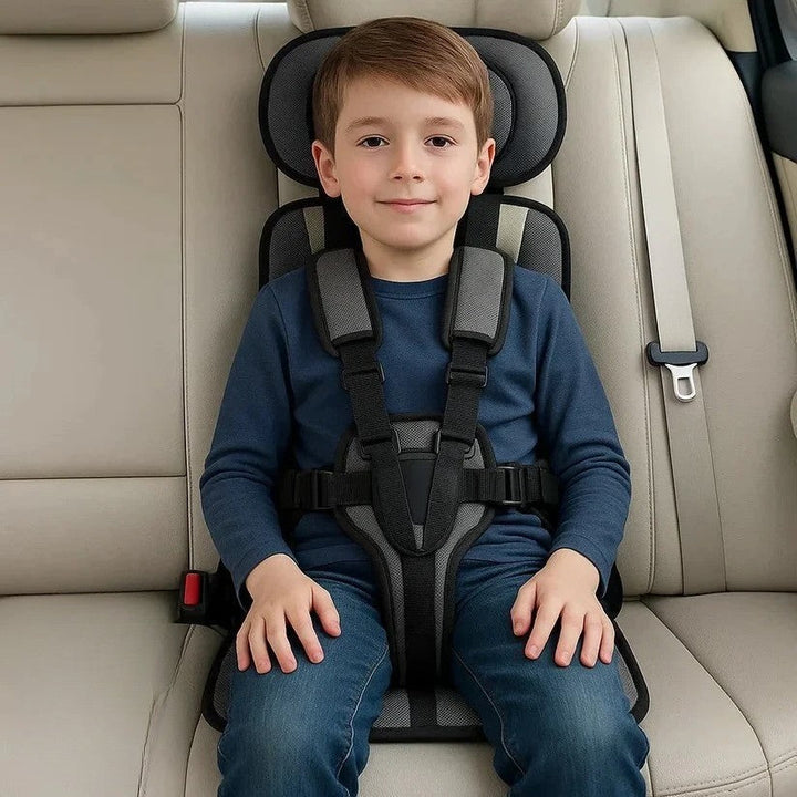 Blue foldable kids travel seat with harness, another view.