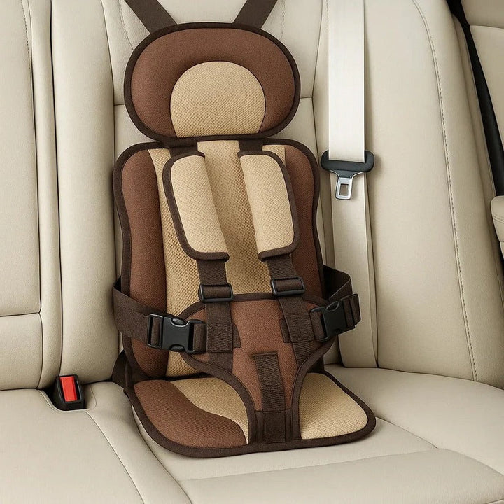 Empty brown and tan foldable kids travel seat showing headrest, shoulder pads and side buckles.