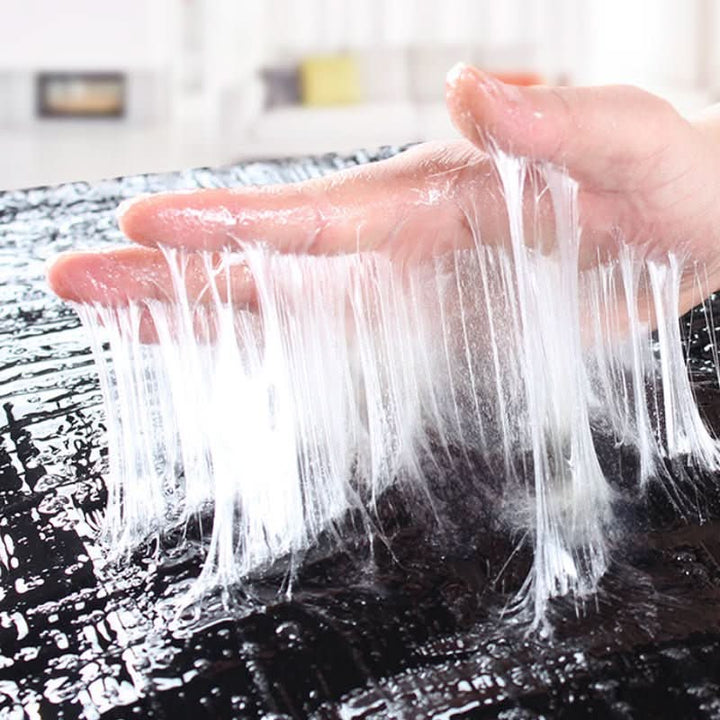 Black Adhesive Pest Trap detail with fine adhesive threads pulled from the sticky surface.