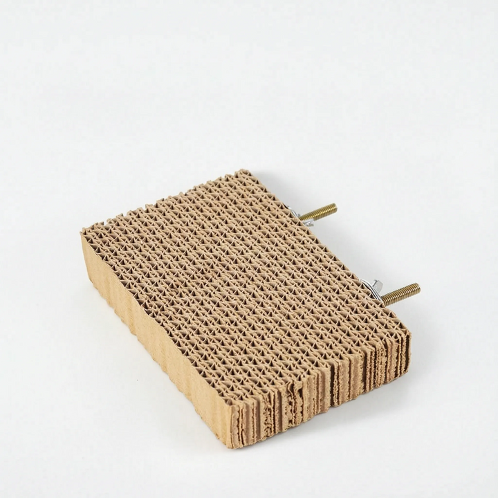 Smaller cardboard platform seen at an angle, with two threaded brass mounting bolts and nuts attached to the back edge. 7