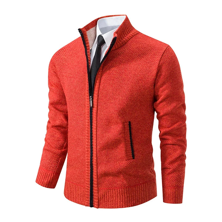 Angled side view of the orange cardigan, showing the zipper, dark trim and side pocket 23
