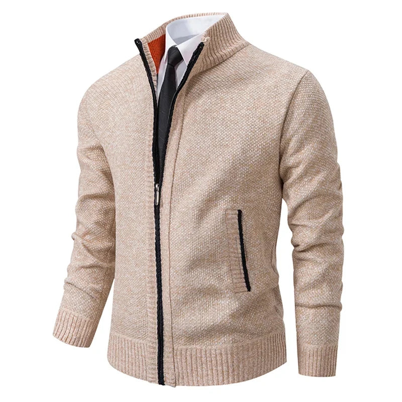 Beige knit zip cardigan at an angle, with black trim and an orange collar lining 3