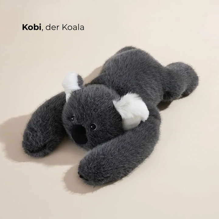Dark gray koala plush with white fluffy ears and a black nose lying with its arms stretched out. 2