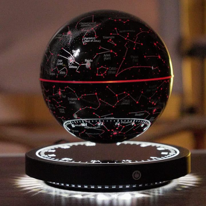Close front view of the levitating globe with red glowing constellations above its black base.