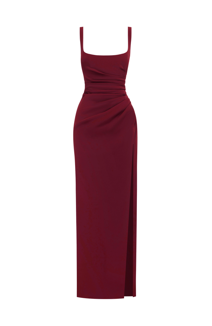 Burgundy gown shown alone on a white background, with square neckline, wide straps, ruched waist and a high slit on the right. 23