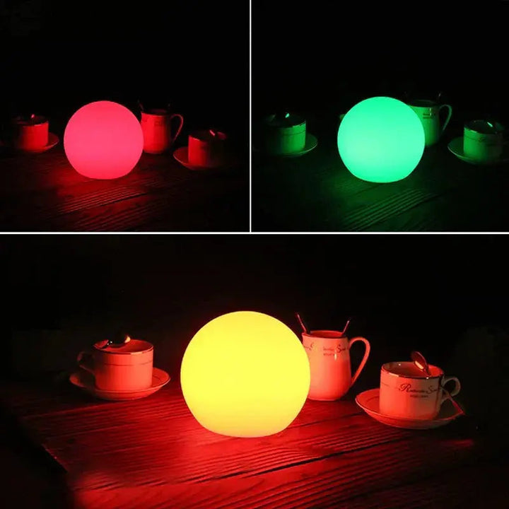 Three white orb lamps glowing in different colors