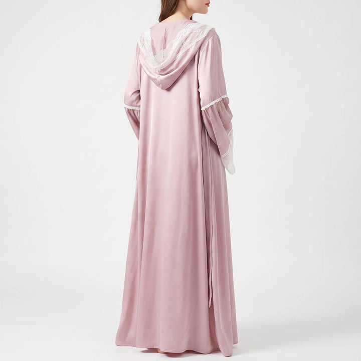 Back view of the long pink satin robe on a model, showing the lace-trimmed hood and gathered lace-edged sleeves. 2