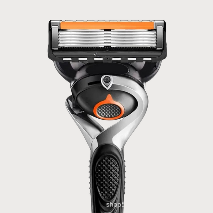 Close-up of the razor head and upper handle, showing the pivoting orange-ringed ball joint, textured grip and six-blade cartridge.
