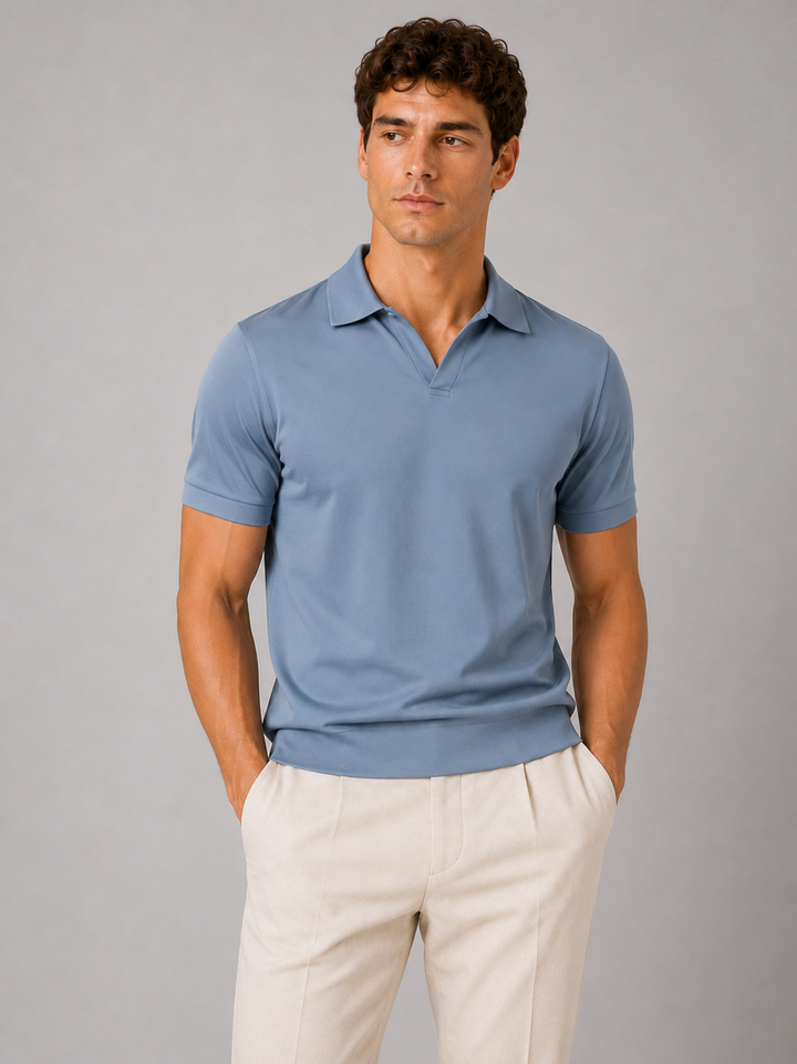 Dusty blue silky touch polo shirt with V placket, front view on a model.