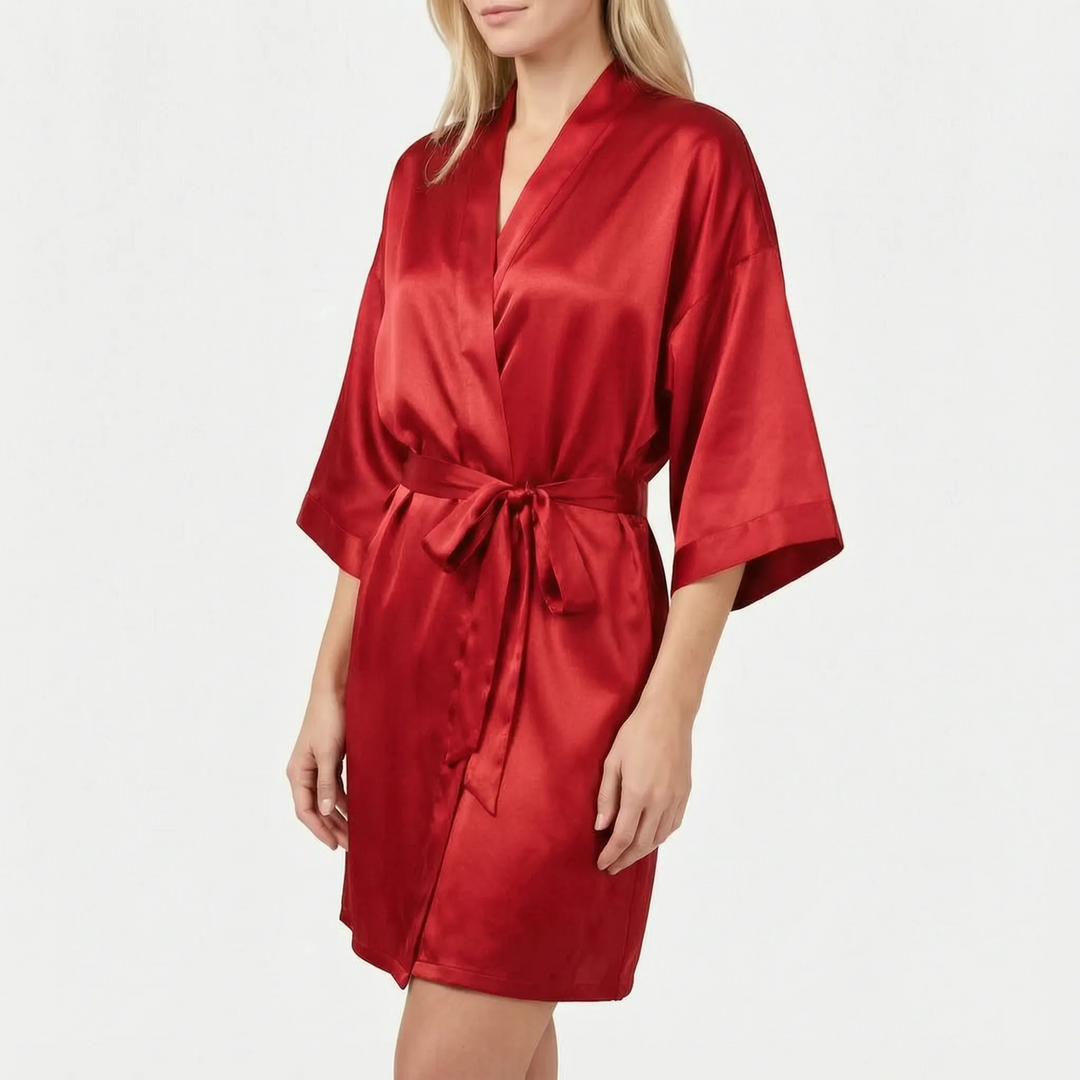 Model wearing the robe in rich red satin with a tied belt and wide three-quarter sleeves. 11