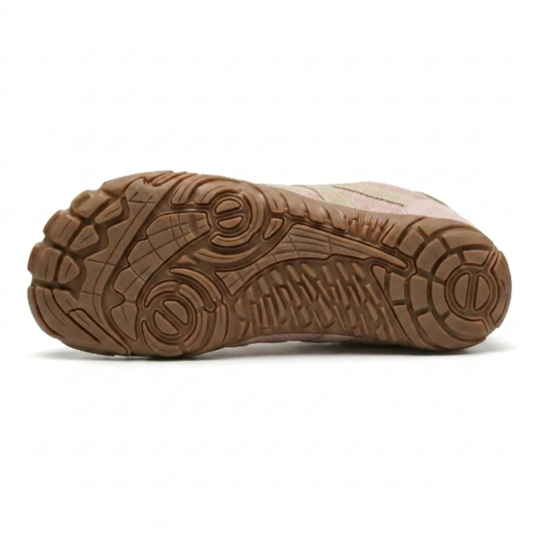 Lilia Women's Barefoot Shoes in pink, bottom view of the tan rubber outsole and wide toe area.
