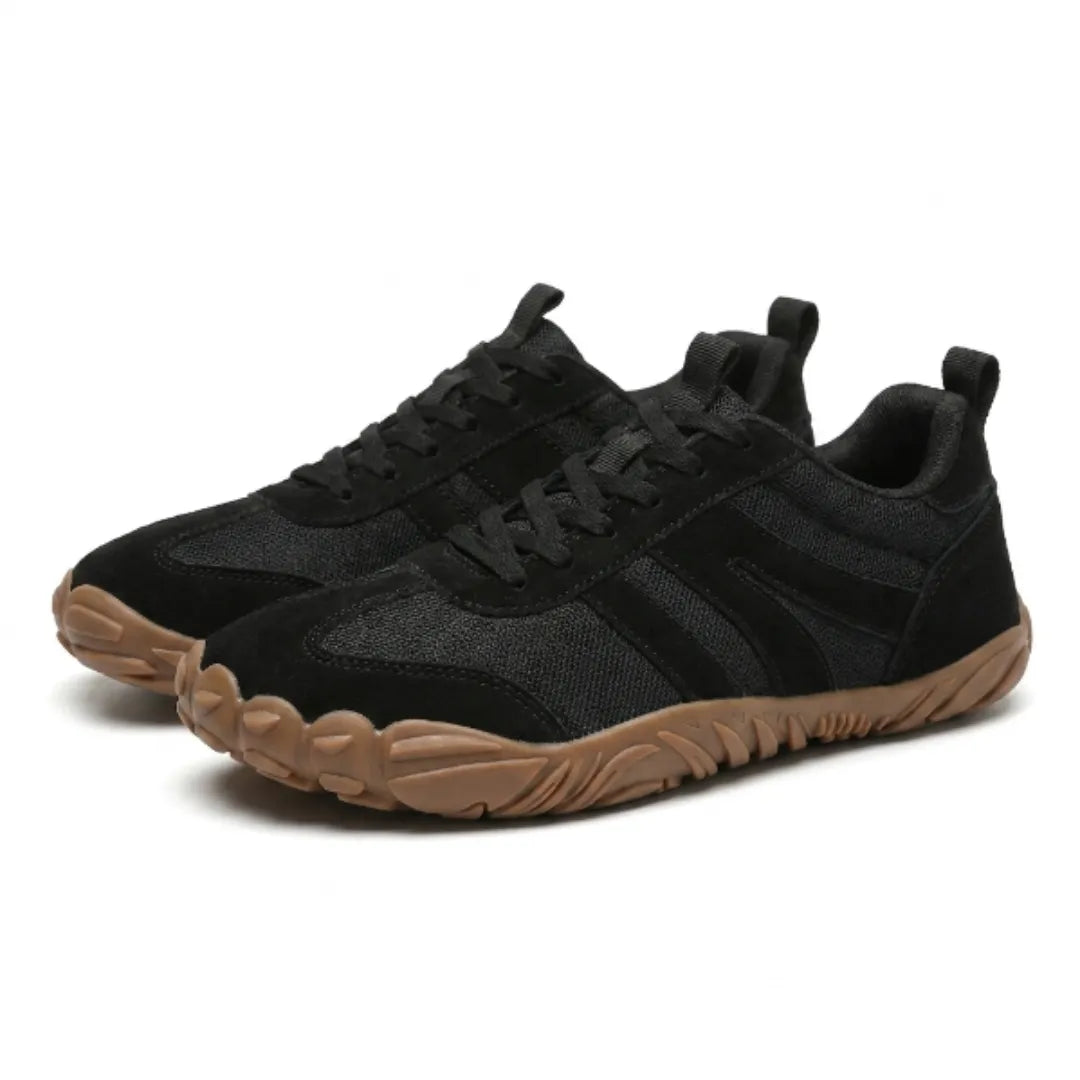 Pair of black mesh and suede lace-up barefoot sneakers with striped side panels and a tan gum sole, shown at an angle. 25