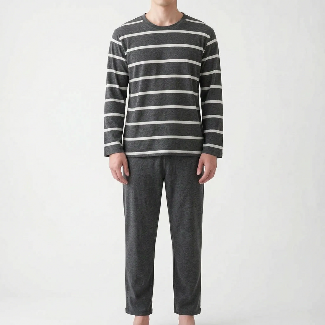 Model wearing a darker charcoal version of the striped long-sleeved top with white stripes and matching charcoal pants. 8