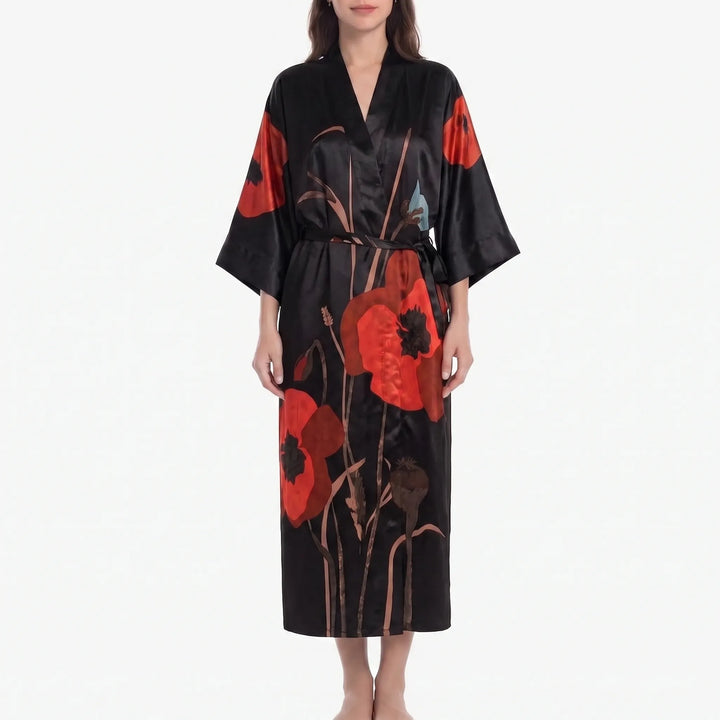 Model in a black satin kimono robe with large red poppy flowers and tall stems, tied with a matching black belt. 9