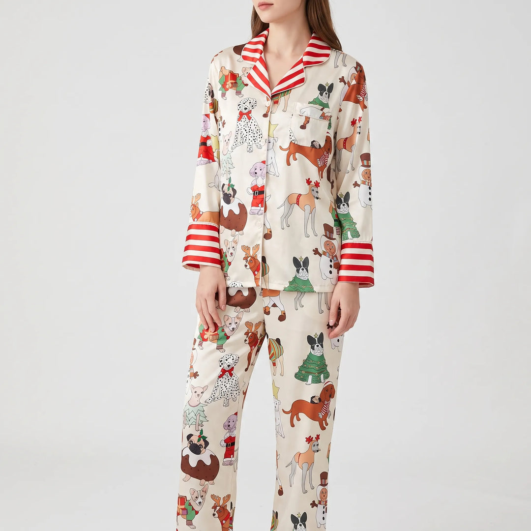 Pajama set in a different print: cream with dogs in holiday costumes and red and white striped collar and cuffs. 12
