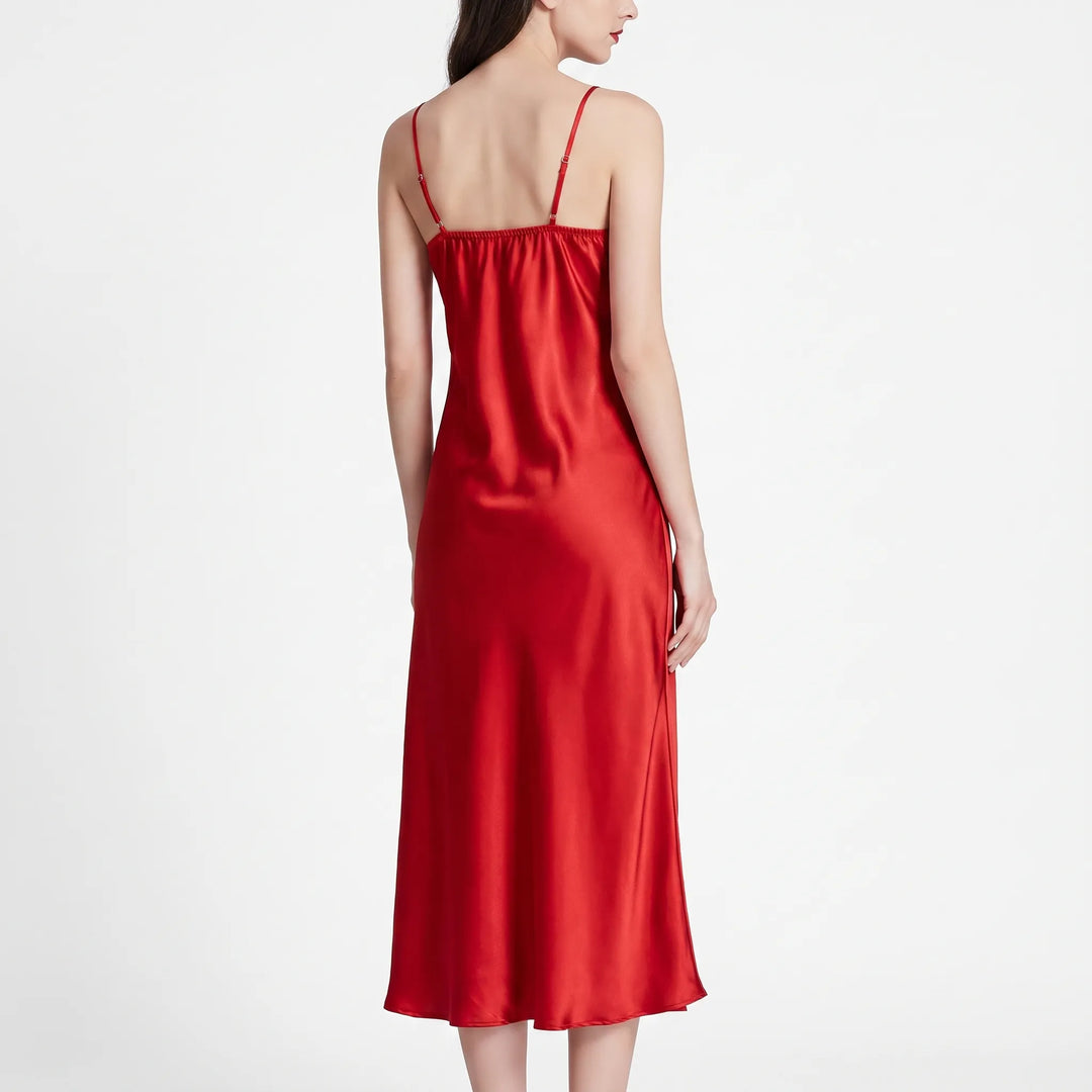 Back view of the red satin nightdress on a model, showing thin adjustable straps and smooth draped fabric. 3