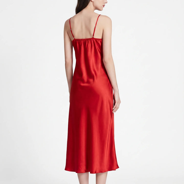 Back view of the red satin nightdress on a model, showing thin adjustable straps and smooth draped fabric. 3