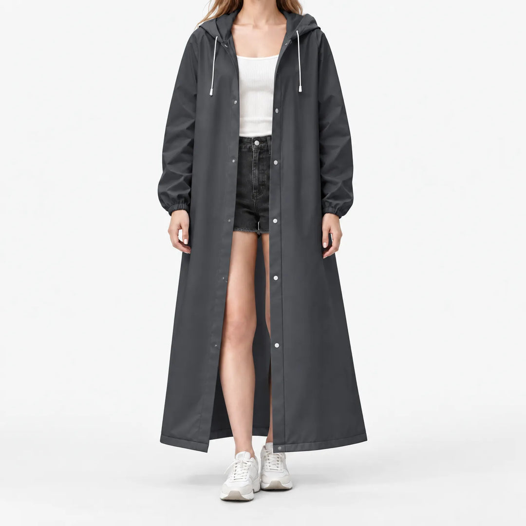 Studio front view of a model in the charcoal hooded coat, open over a white tank, with silver-toned snap buttons. 11