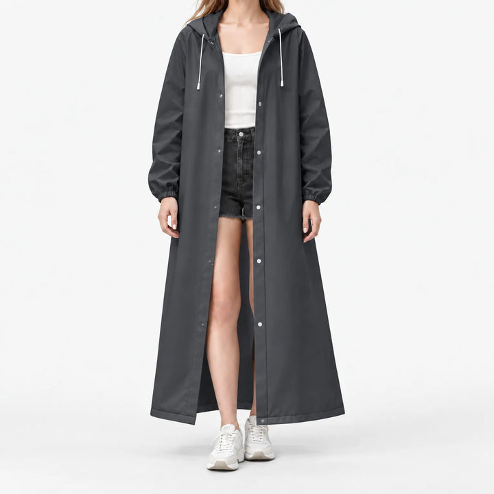 Studio front view of a model in the charcoal hooded coat, open over a white tank, with silver-toned snap buttons. 11