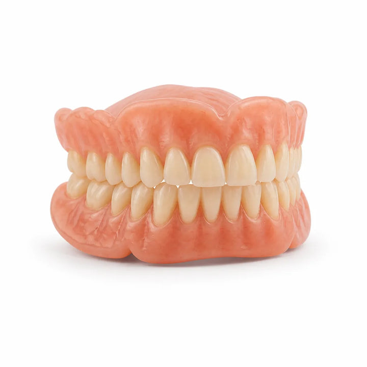 Front view of an upper and lower denture set on a plain white background, with pink gum bases and natural-looking teeth. 2
