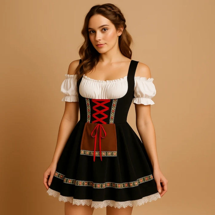 Woman in a black off-shoulder dirndl with red criss-cross lacing, brown apron and lace-trimmed skirt 7