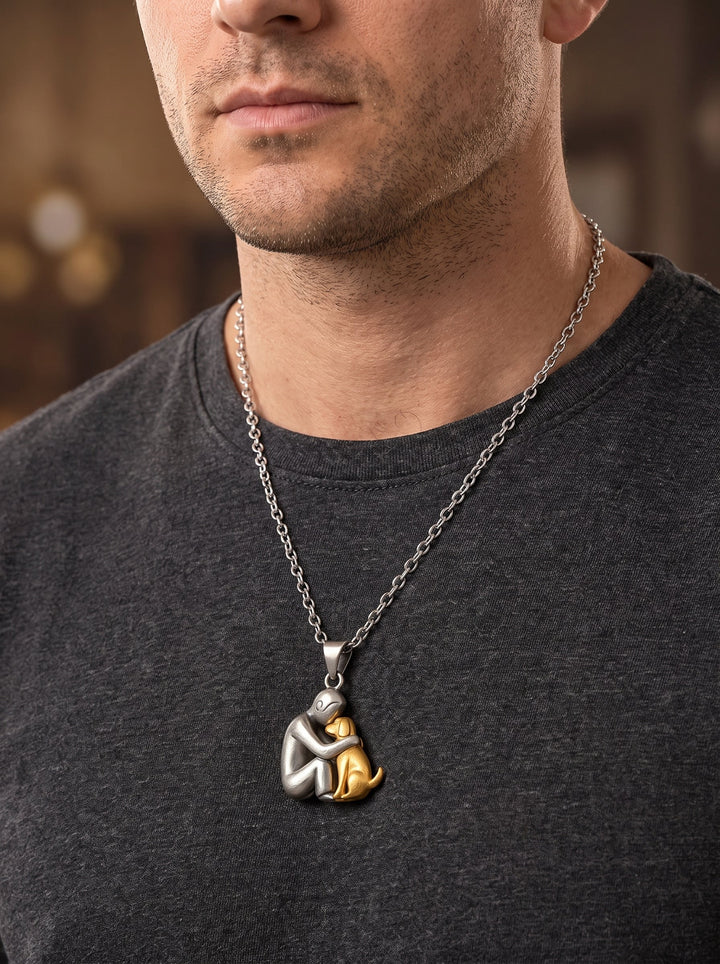Man in a dark gray t-shirt wearing the matte silver-tone figure and gold-tone dog pendant on a longer chain. 11