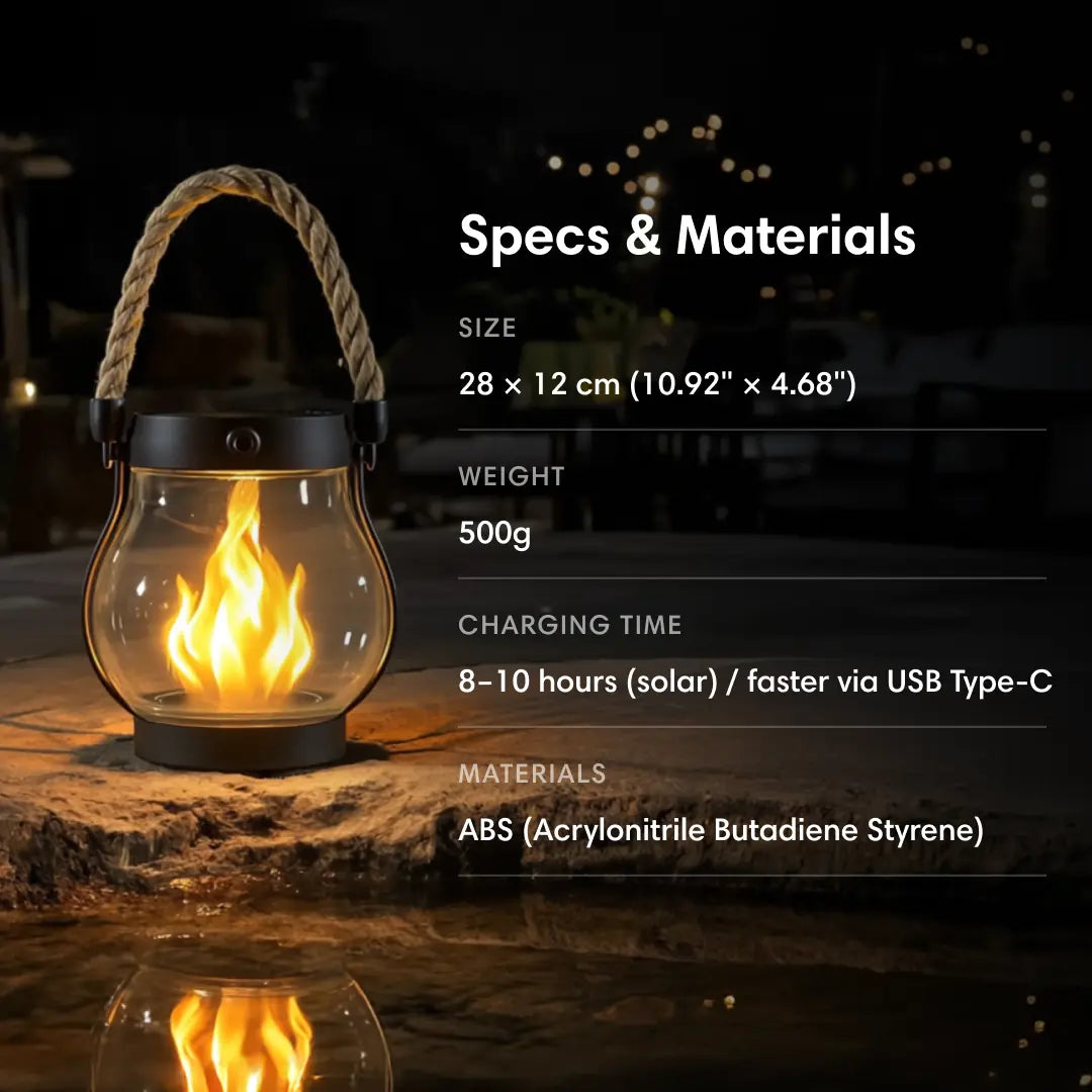 Black solar lantern with a rope handle glowing on a stone ledge at night, detail.