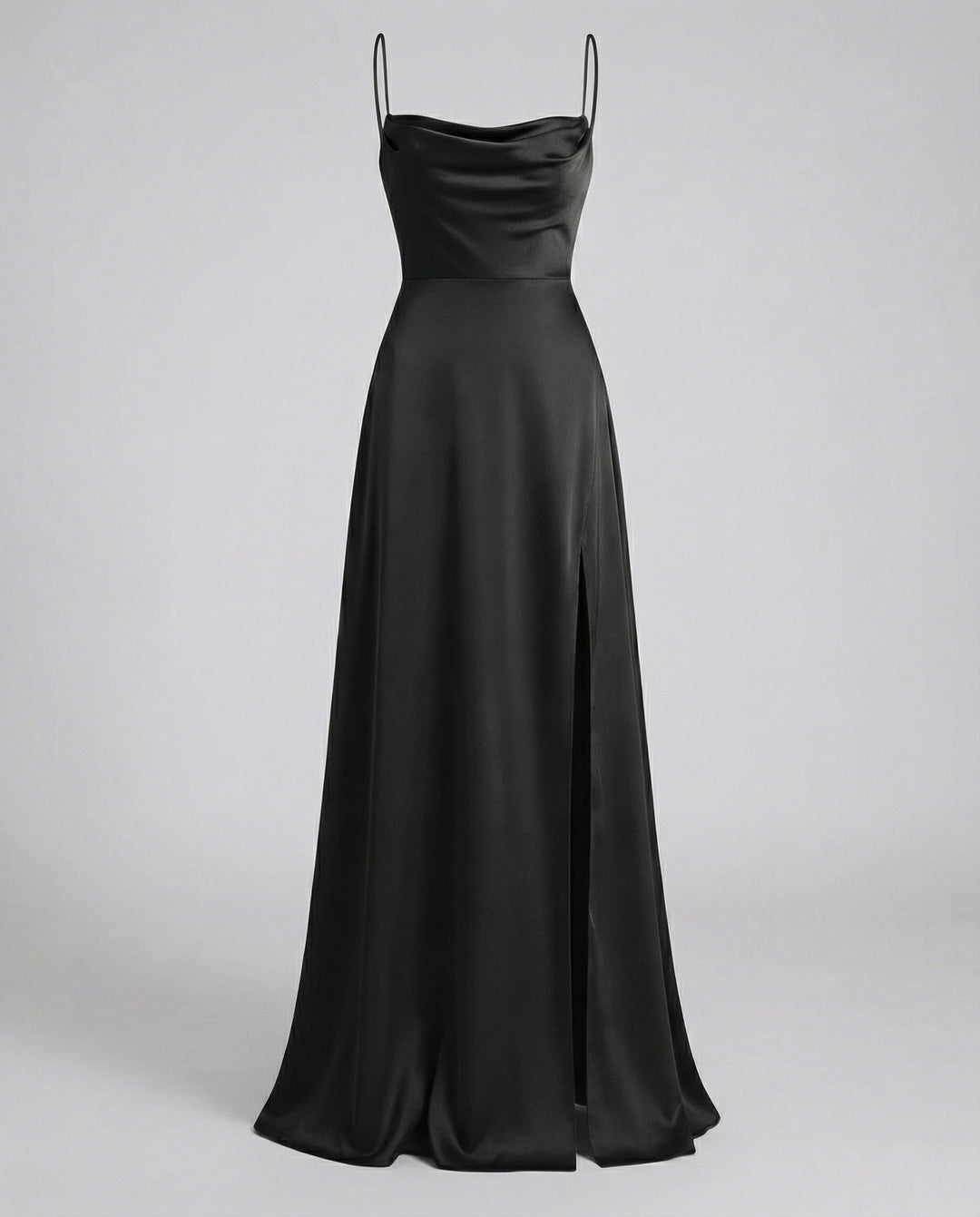 Black satin maxi dress shown flat, with cowl neckline, thin straps, fitted bodice and a flowing slit skirt.
