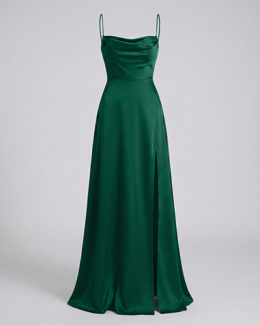 Dark green satin maxi dress shown flat, with cowl neckline, spaghetti straps, fitted waist and a slit skirt.