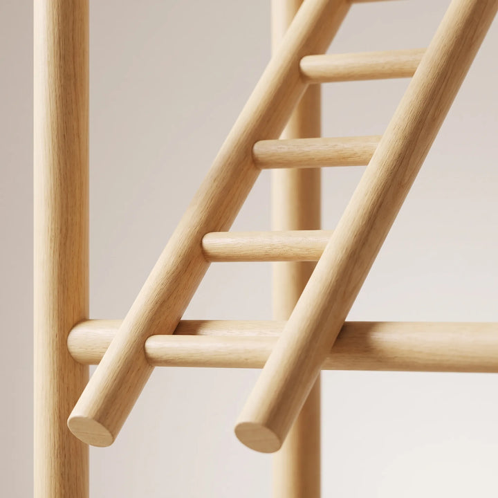 Close-up of a smooth natural wood ladder and round perch poles, showing the fine grain and rounded ends of the dowels. 4