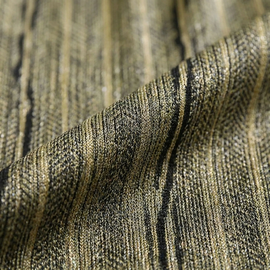Close-up of the ribbed, knit-like fabric in olive and black tones, folded to show its texture and subtle sheen. 5