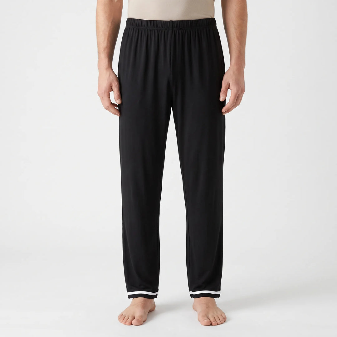 Front view of black pajama bottoms with an elastic waist and contrasting white double stripes at each ankle hem. 6