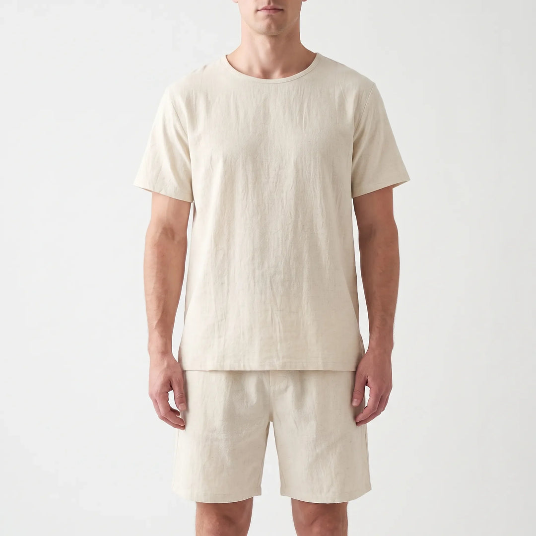 Straight-on front view of the cream crew-neck tee and shorts worn by a model against a light backdrop. 6