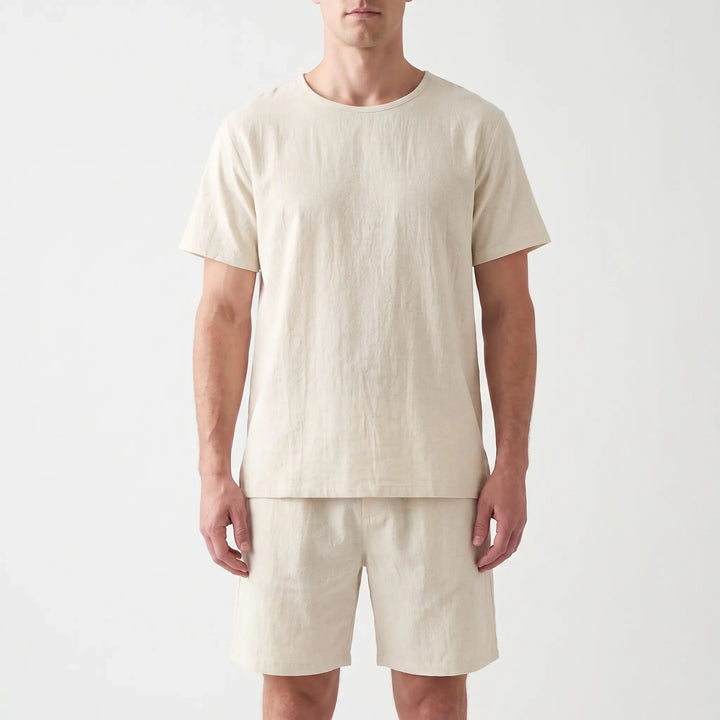 Straight-on front view of the cream crew-neck tee and shorts worn by a model against a light backdrop. 6