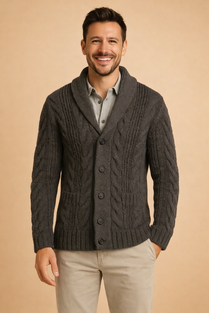 Charcoal gray cardigan front view showing thick cables, shawl collar, dark buttons and ribbed pocket tops 5