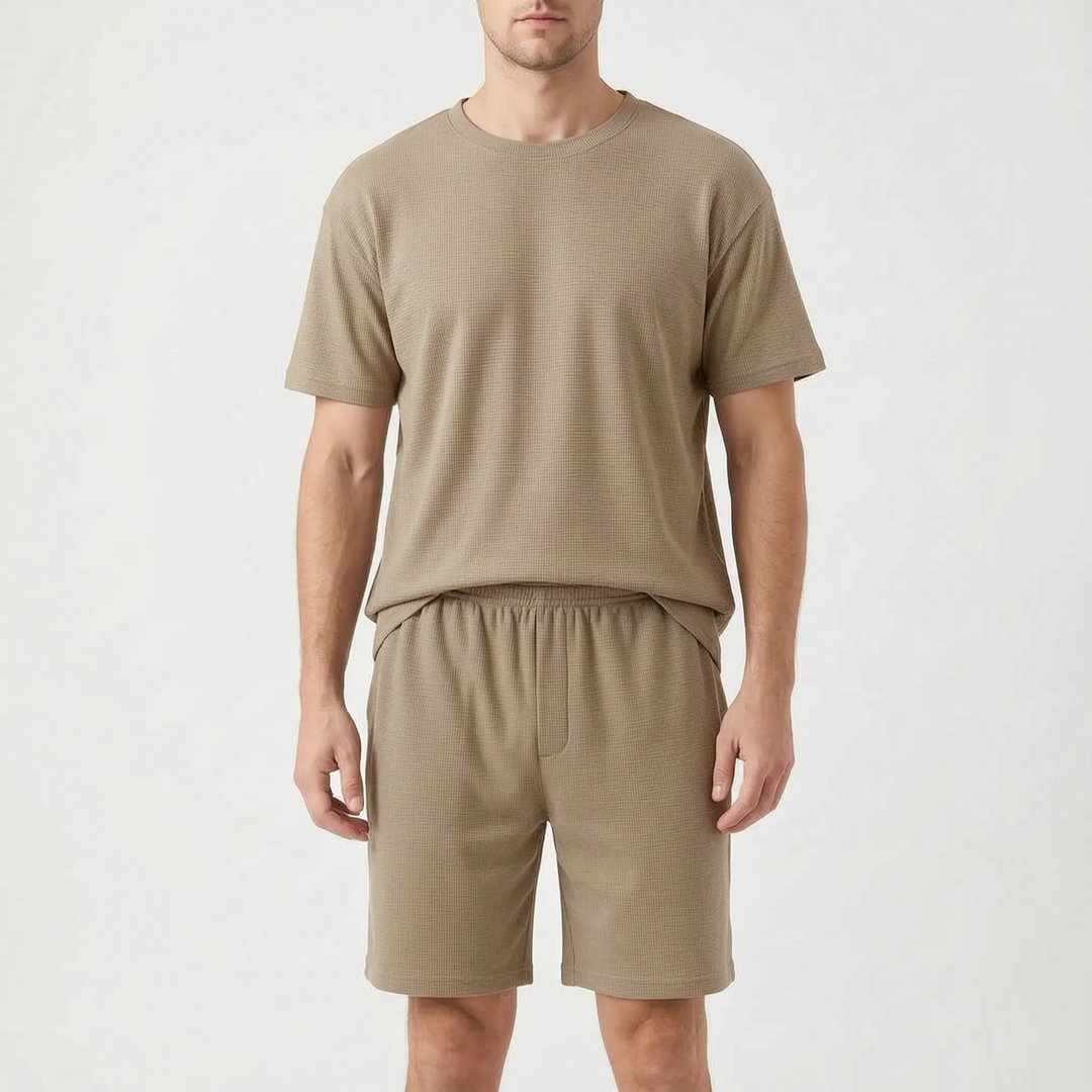 Front view of a model wearing the short pajama set in a tan waffle-knit, with crew neck tee and shorts. 8