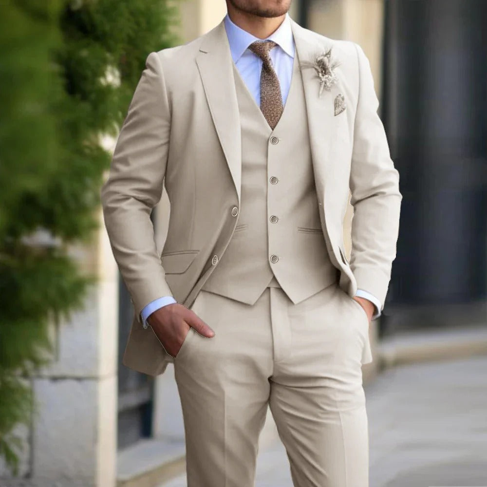 Cropped view of a man in a beige three-piece suit with hands in pockets on a street 2