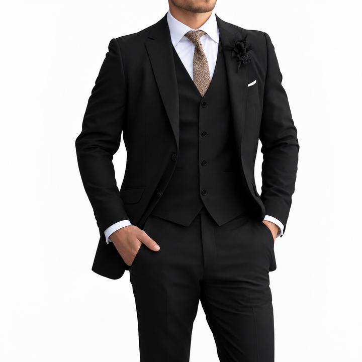 Model in a black three-piece suit with white shirt and brown tie, shown against a plain white background 5