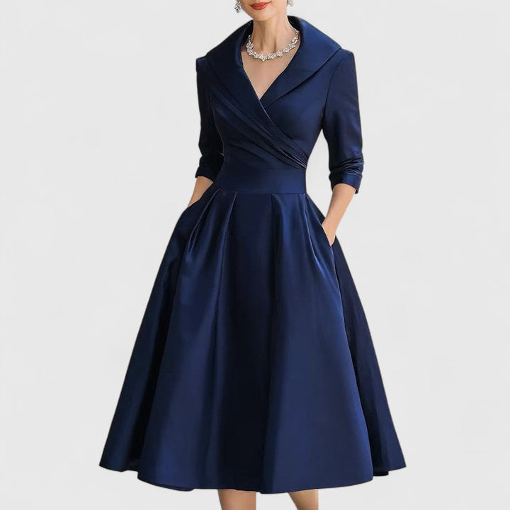 Navy satin A-line dress with a wide wrap collar and side pockets.