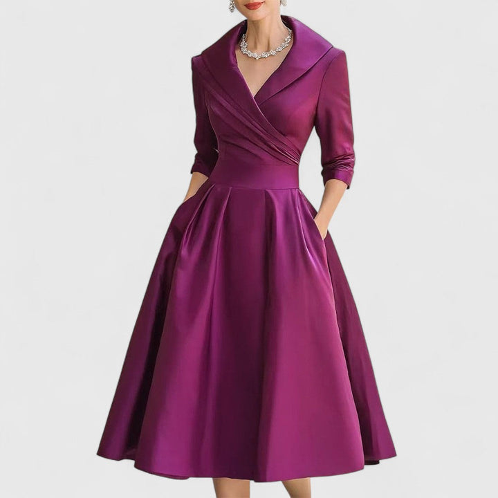 Rich magenta-plum satin dress, front view with a wrap bodice and pockets.