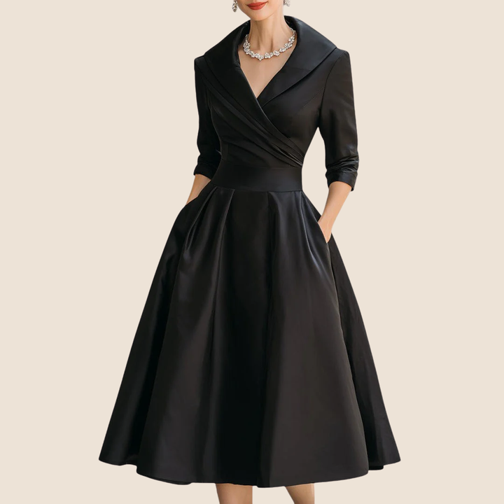 Black satin A-line dress with a wide wrap collar, three-quarter sleeves and pockets.