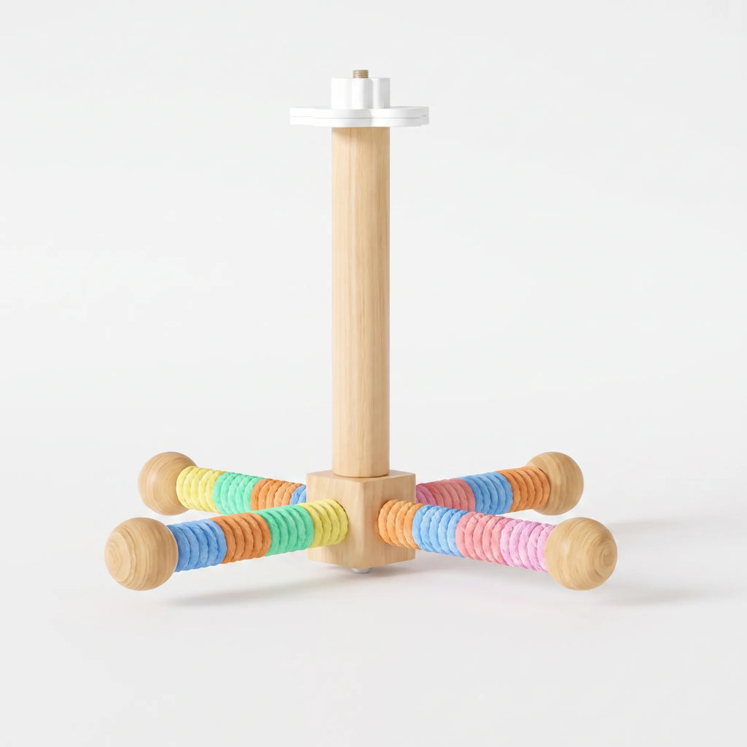 Version of the perch with rainbow-colored rope on the four arms in blue, orange, green, yellow and pink, against a plain white background. 4